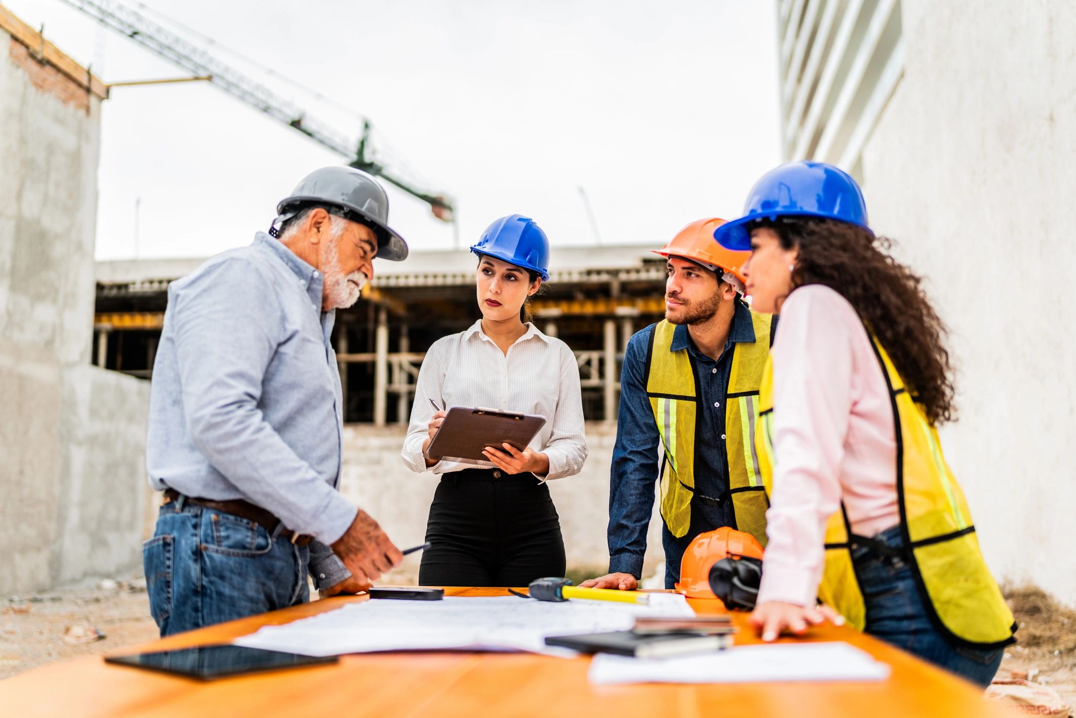 Engineers reviewing construction drawings and plans