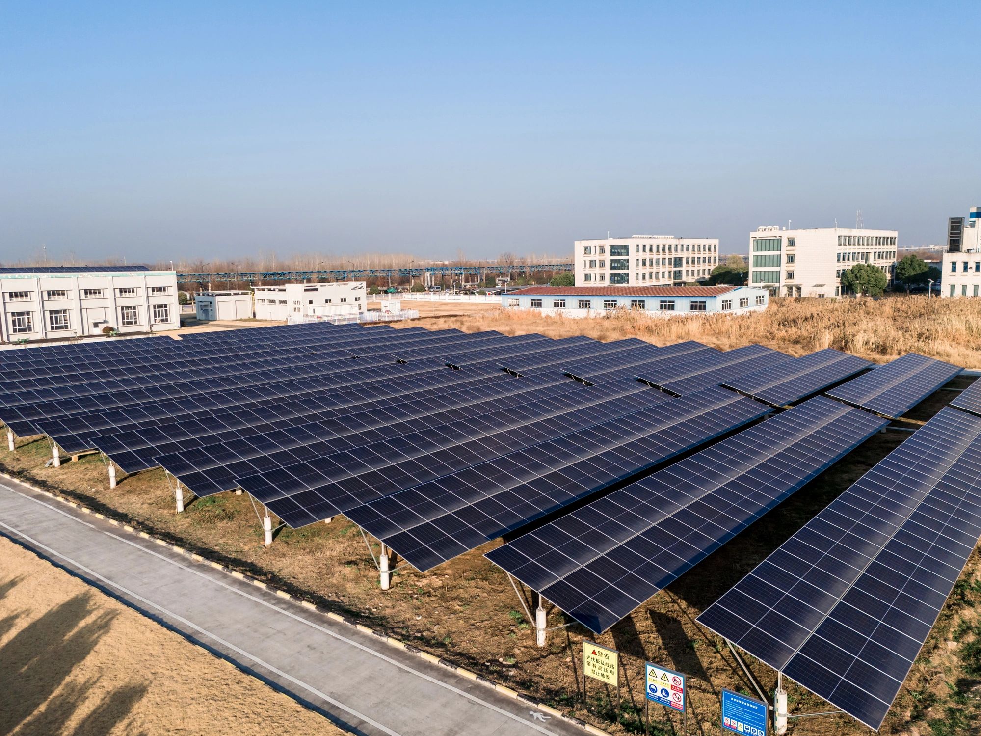 Aerial view of a solar panel array in a field