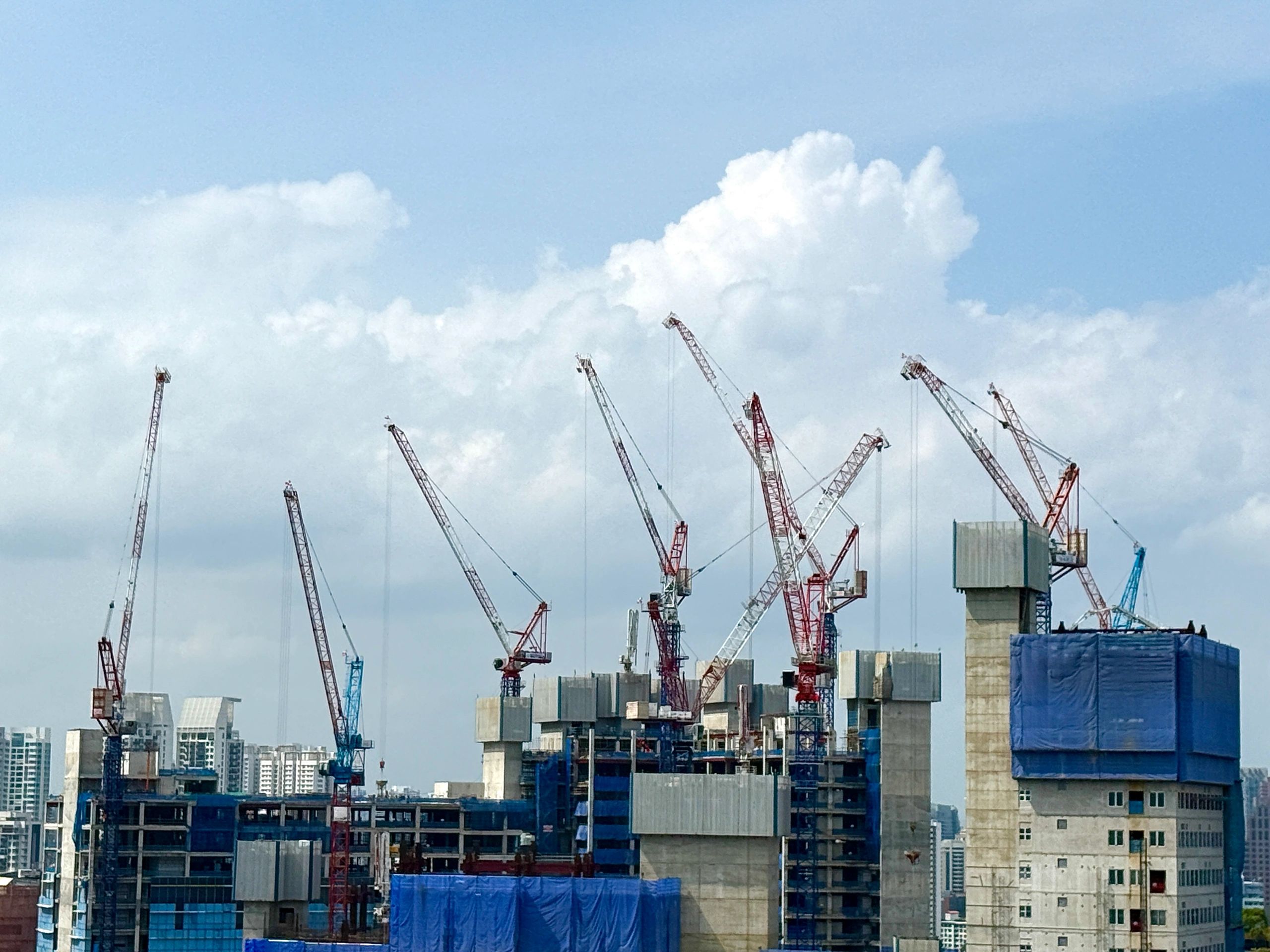 Construction site with cranes and buildings under construction